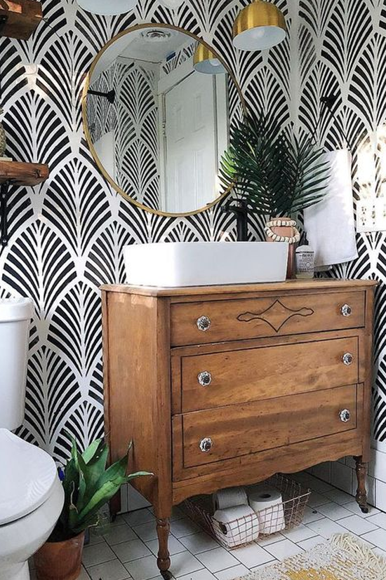 black and white wallpaper in bathroom with wood vanity