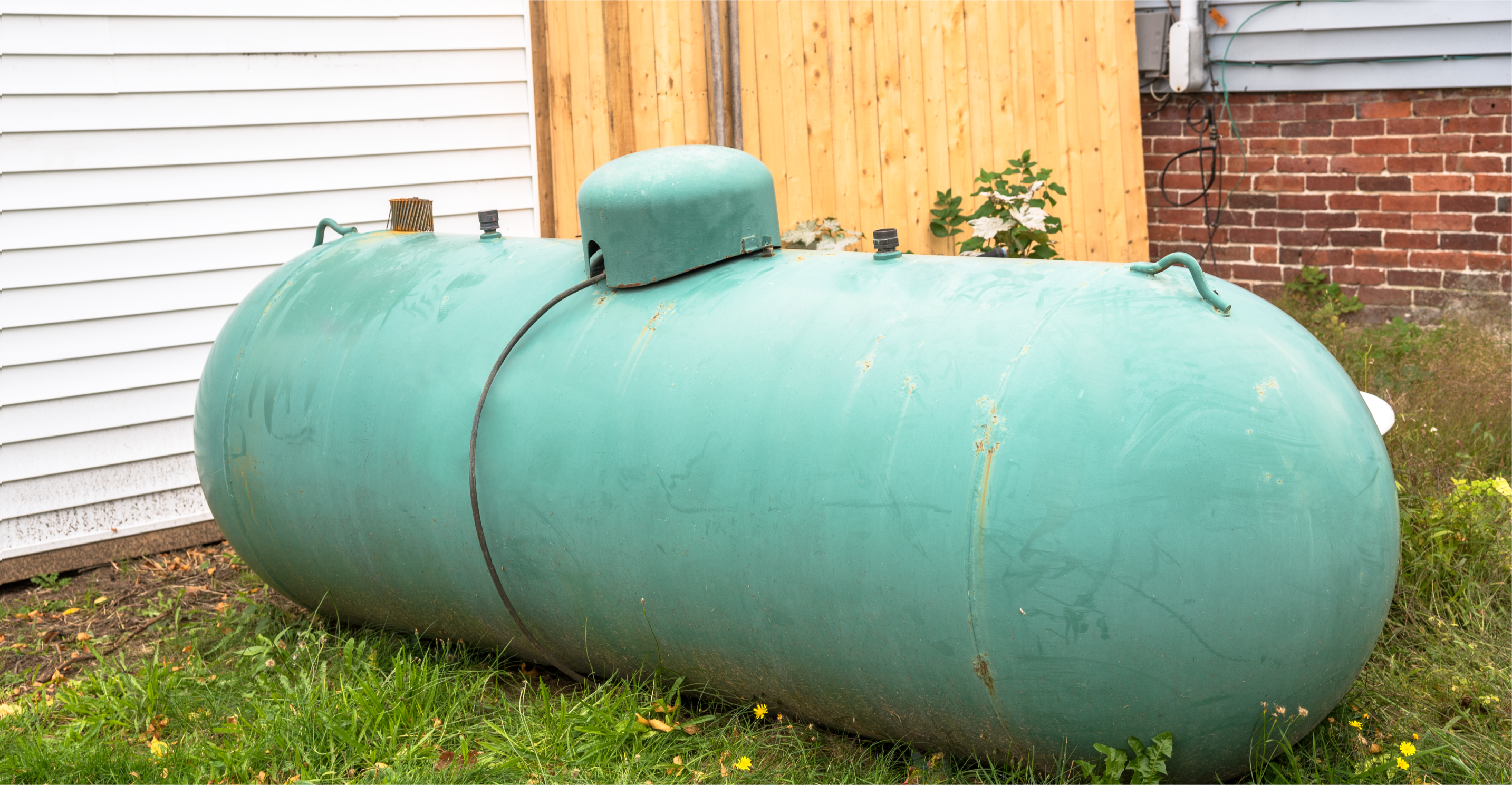 above ground propane tank by house