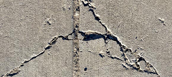 repair or replace damaged concrete