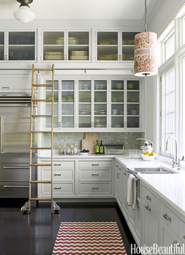 ladders make ceiling-tall cabinets easy to reach