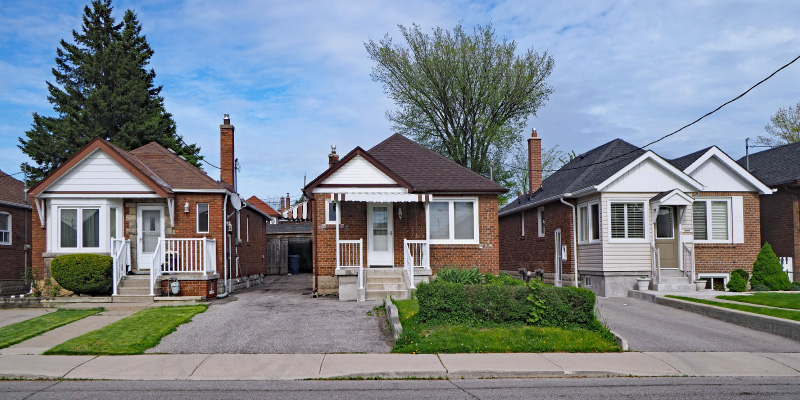 street view of three modest outdated homes