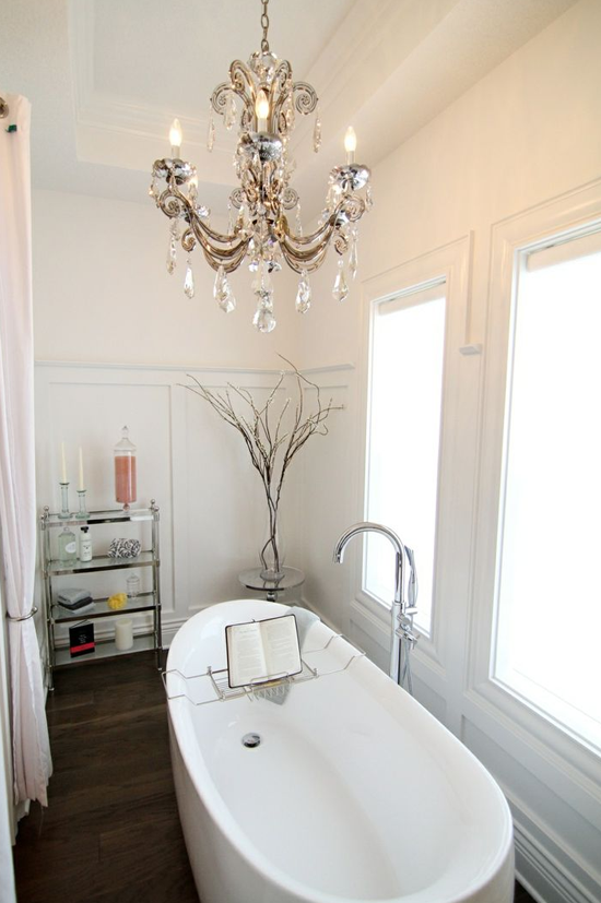 fancy chandelier above bathtub