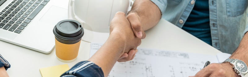 contractor shaking hands with customer