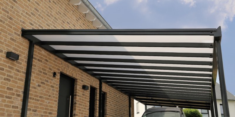 metal carport attached to brick building