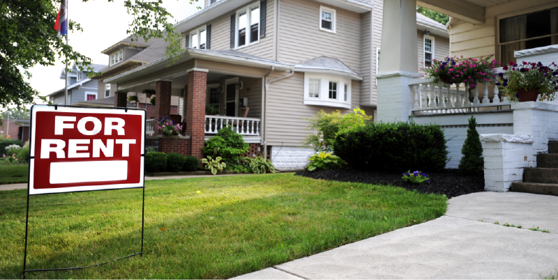 for rent sign in house front yard