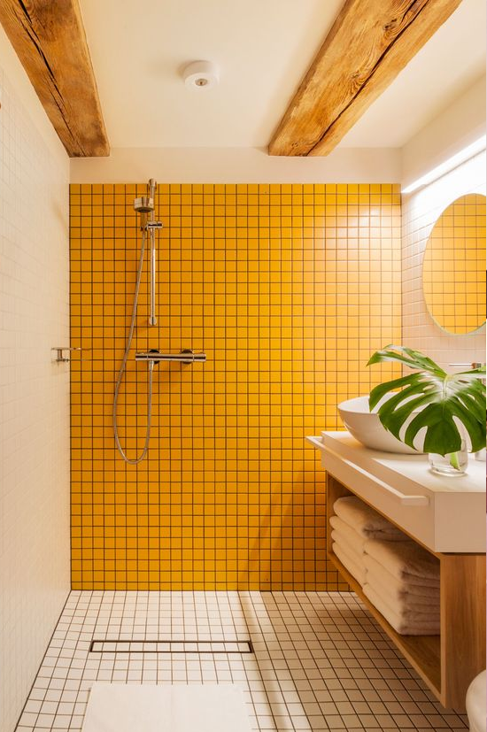 yellow tile wall in bathroom