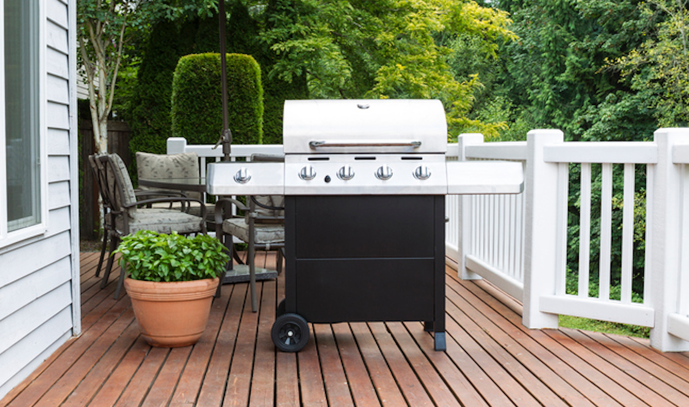 grill and dining area on wood deck