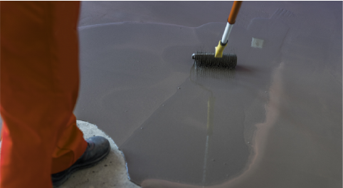 spreading sealant/paint on basement floor