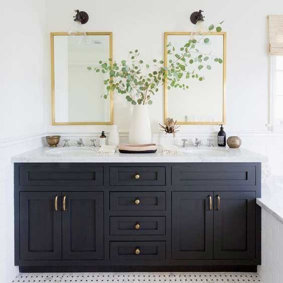 bathroom remodel with dark blue cabinets