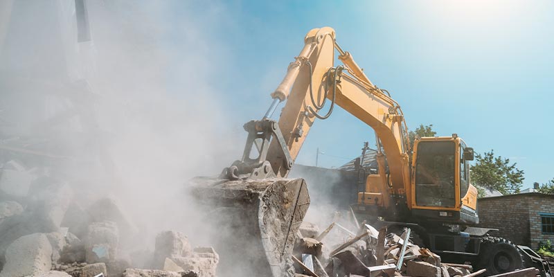 excavator performing demolition