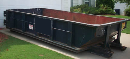 temporary roll-off dumpster in driveway