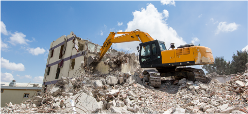 excavator demolishing structure