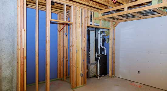 unfinished basement with framing exposed