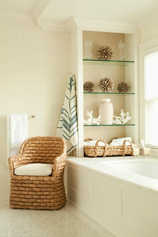 wicker egg chair next to bathtub