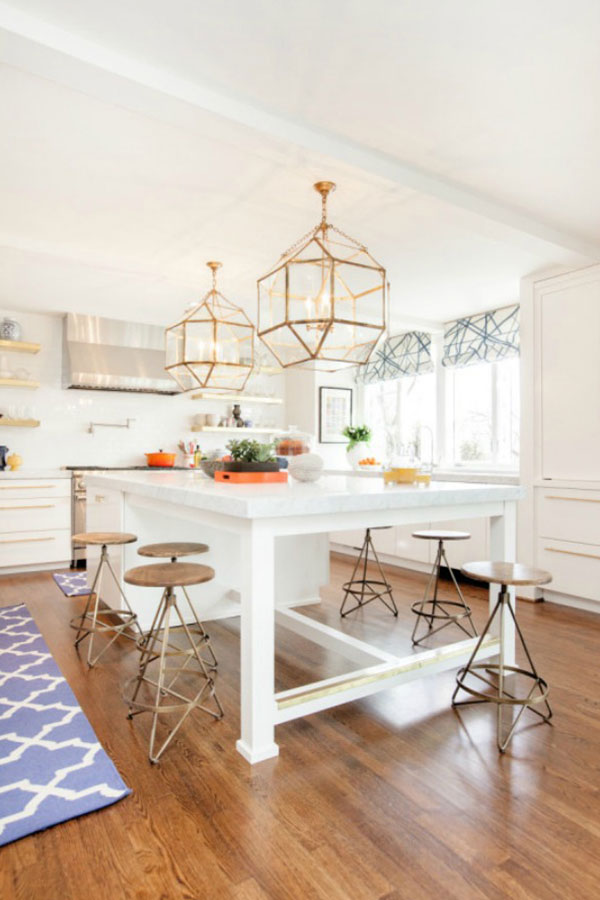 oversized lighting adds functional drama to kitchens