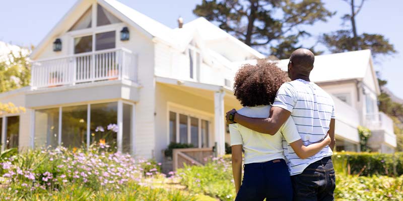 couple appreciating their home's exterior