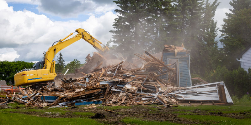 house demolition by excavator