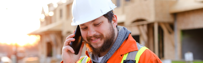 contractor taking cell phone call on site