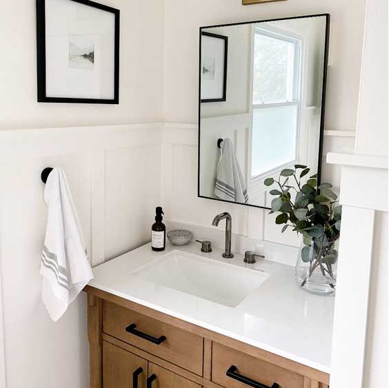 bathroom remodel with wood cabinets