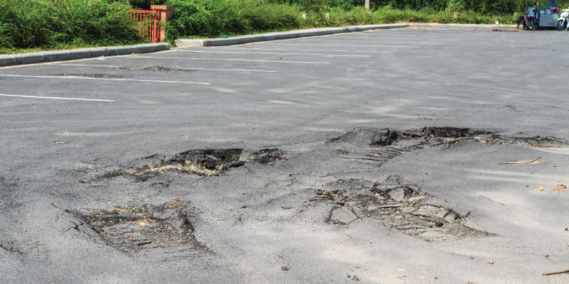 damaged asphalt parking lot