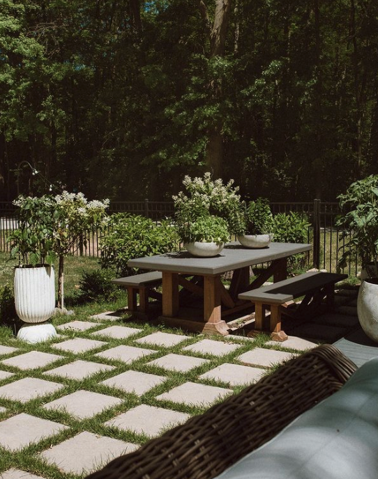 outdoor living space with paver stones and mixed material seating