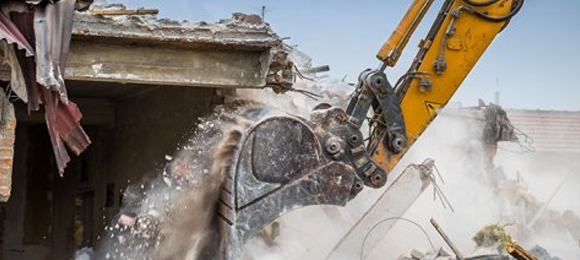 excavator doing house demolition